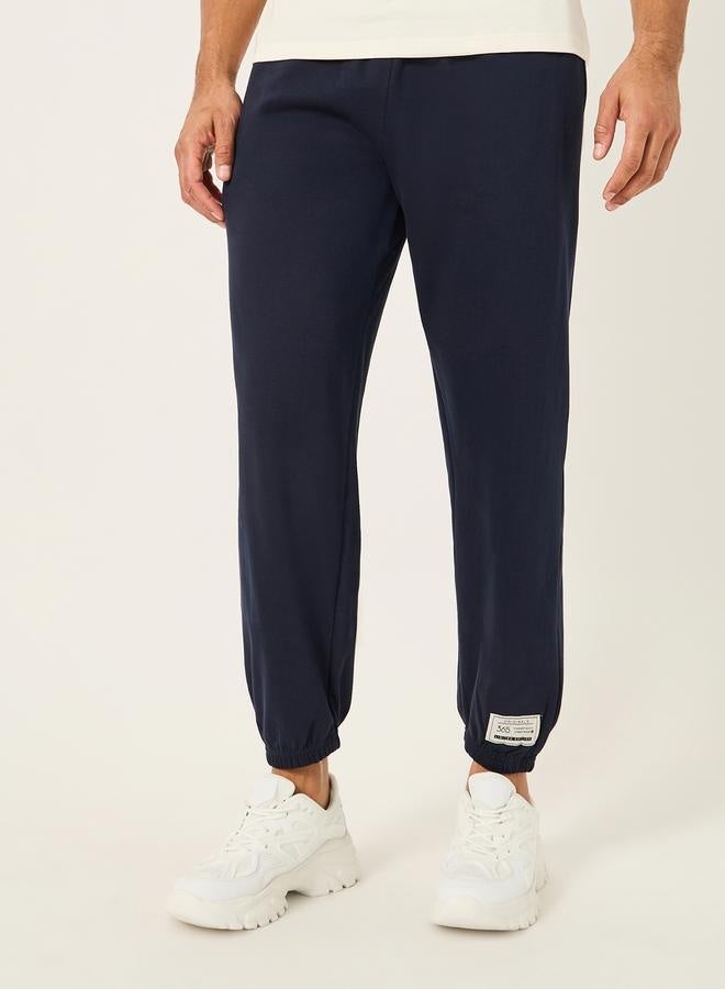 Styli Relaxed Fit Fleece Badge Detail Joggers with Zip Pockets  - Image 1