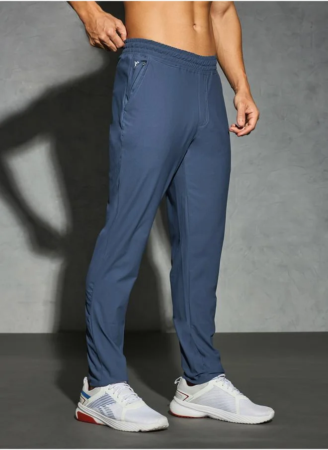 تكنوسبورت Solid 4-Way Stretch Track Pants by Styli