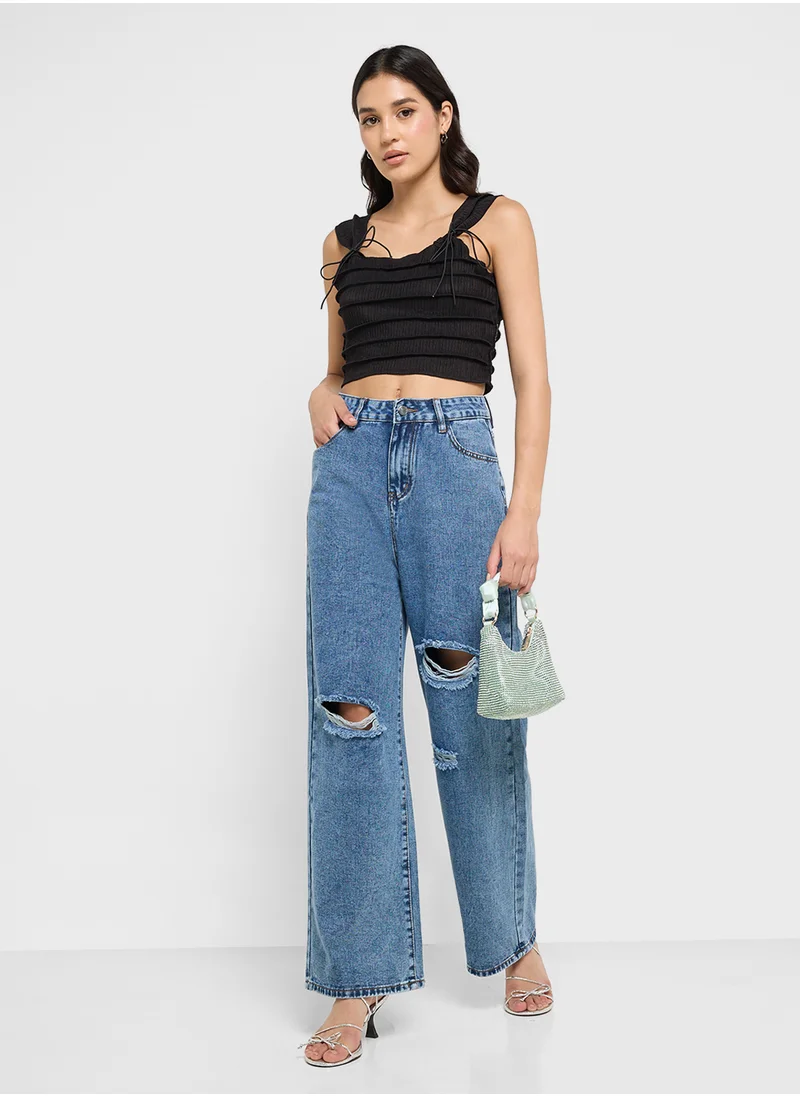 جينجر High Rise Relaxed Fit Ripped Jeans