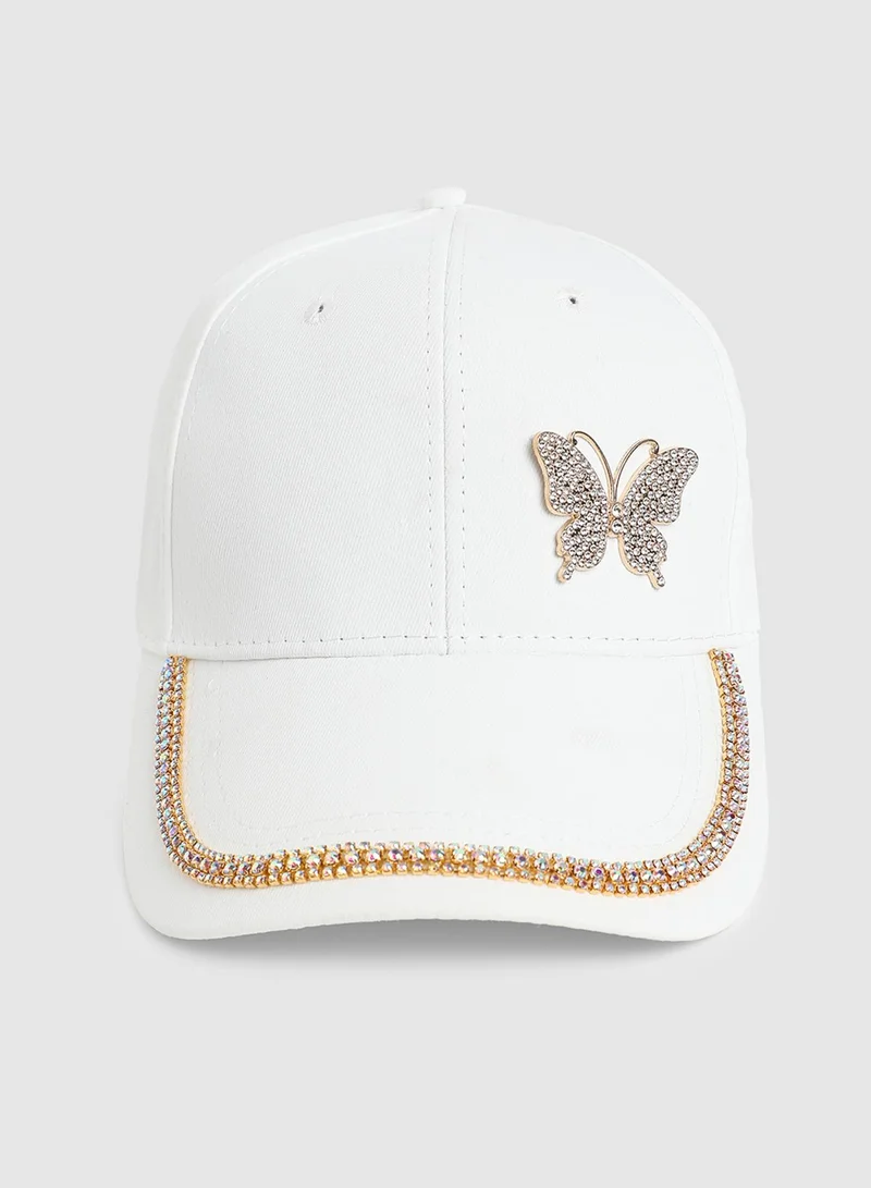 صوص هاوت قبعة بيسبول بفراشة مرصعة بالكريستال - أبيض