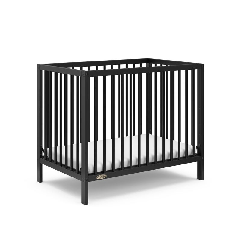 Graco Teddi 4in1 Convertible Mini Crib with Bonus WaterResistant Mattress Black GREENGUARD Gold Certified 275Inch Mattress Included Convenient Size Easy 30Minute Assembly