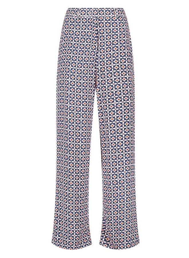 Flowing trousers with an all-over pattern