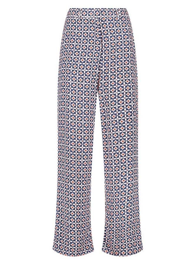 Flowing trousers with an all-over pattern