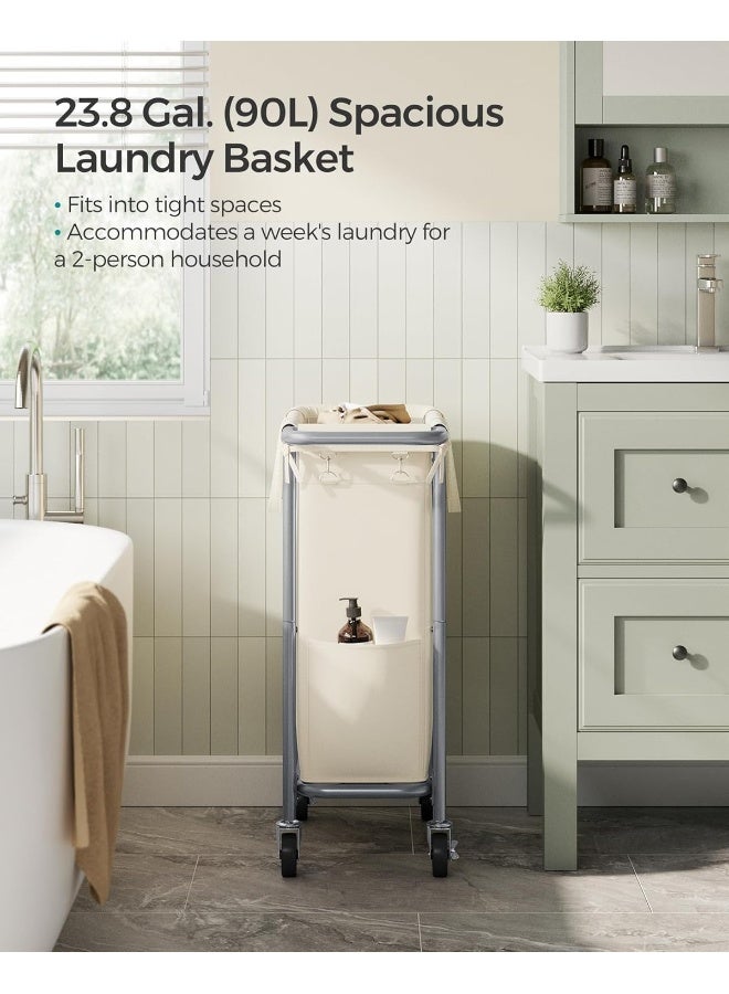 SONGMICS سلة غسيل SONGMICS بعجلات، سلة غسيل متحركة، 23.8 جالون (90 لتر)، بطانة قابلة للإزالة، إطار فولاذي مع مقبض، تخزين البطانيات، 24 × 11.4 × 31.9 بوصة، أبيض كريمي - Image 3