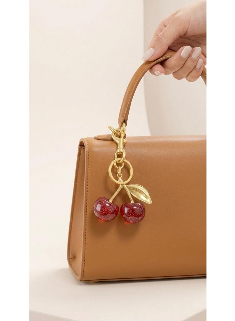 Nevara Shiny 3D cherry pendant with a modern design – stylish bag and key accessory - Image 5