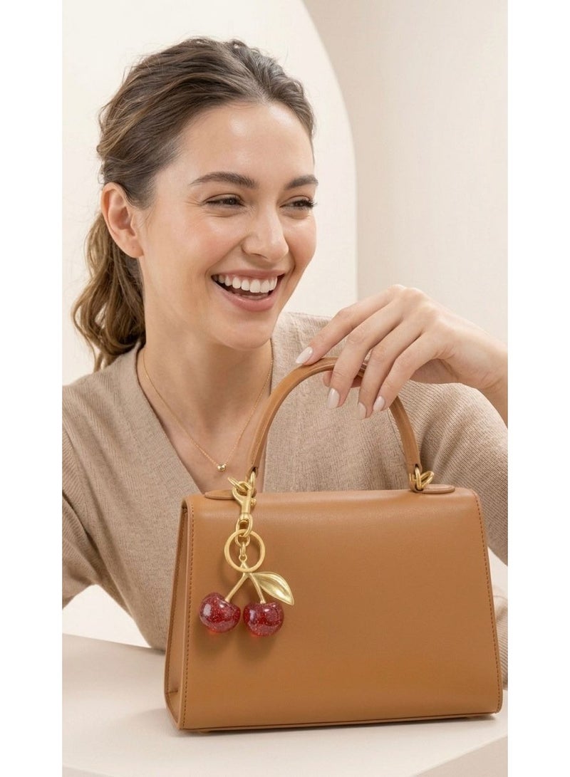 Nevara Shiny 3D cherry pendant with a modern design – stylish bag and key accessory - Image 2