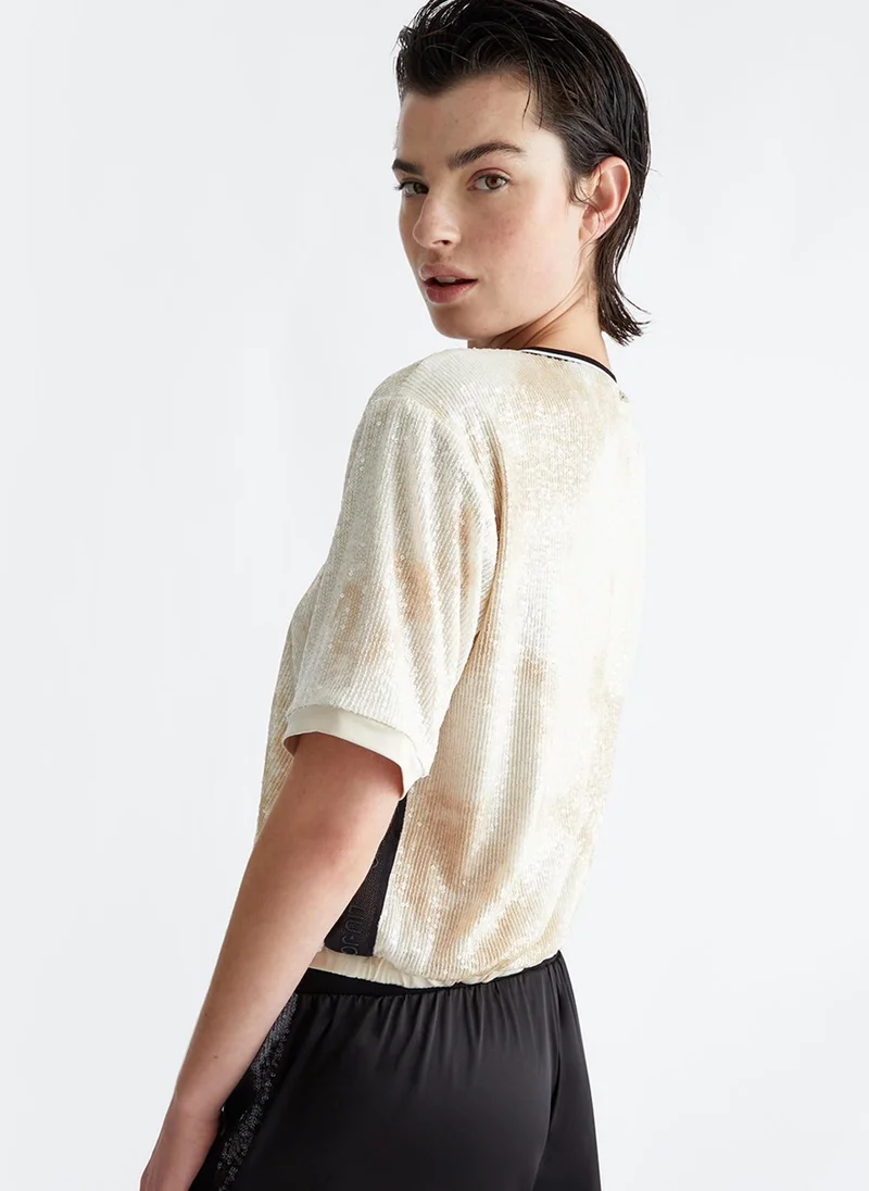 ليو جو سويت شيرت مزين بالترتر