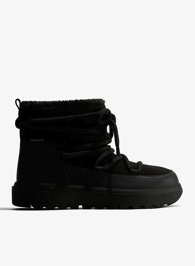 اتش اند ام بووت للثلج ببطانة ناعمة ودافئة