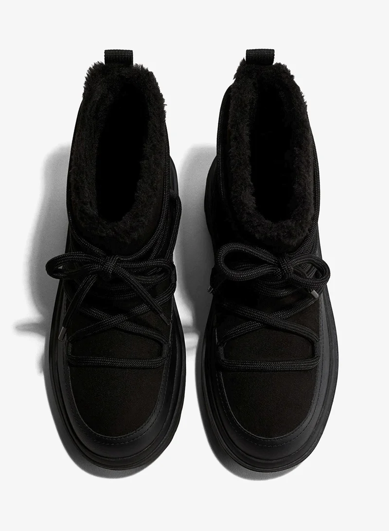 اتش اند ام بووت للثلج ببطانة ناعمة ودافئة