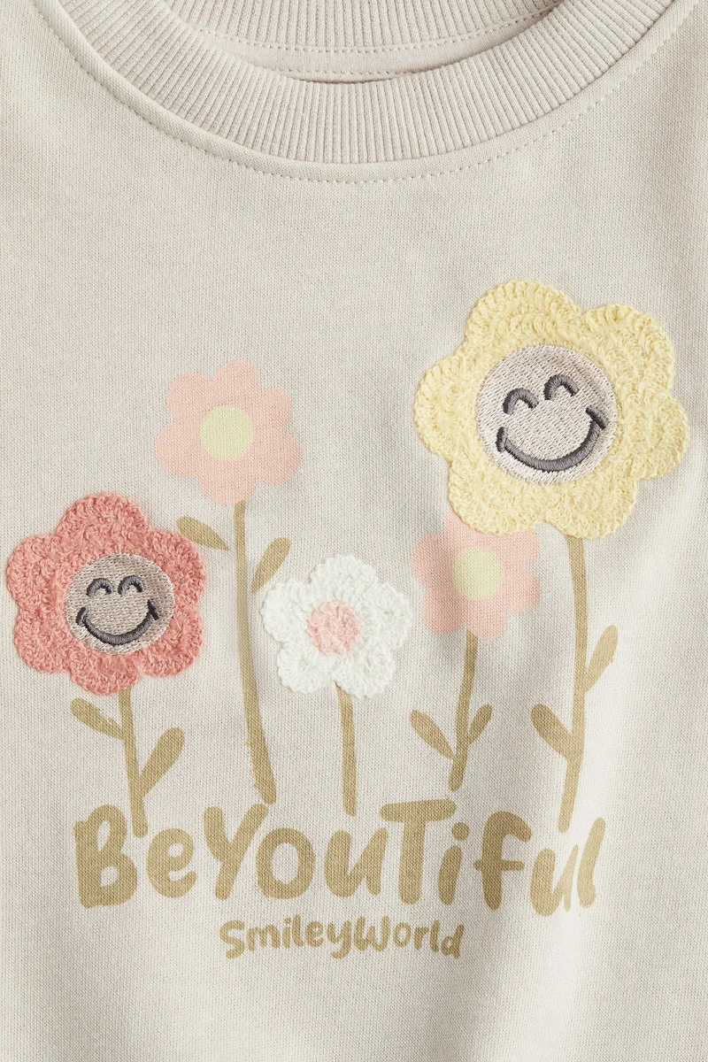 اتش اند ام سويت شيرت مزينة بزخرفة