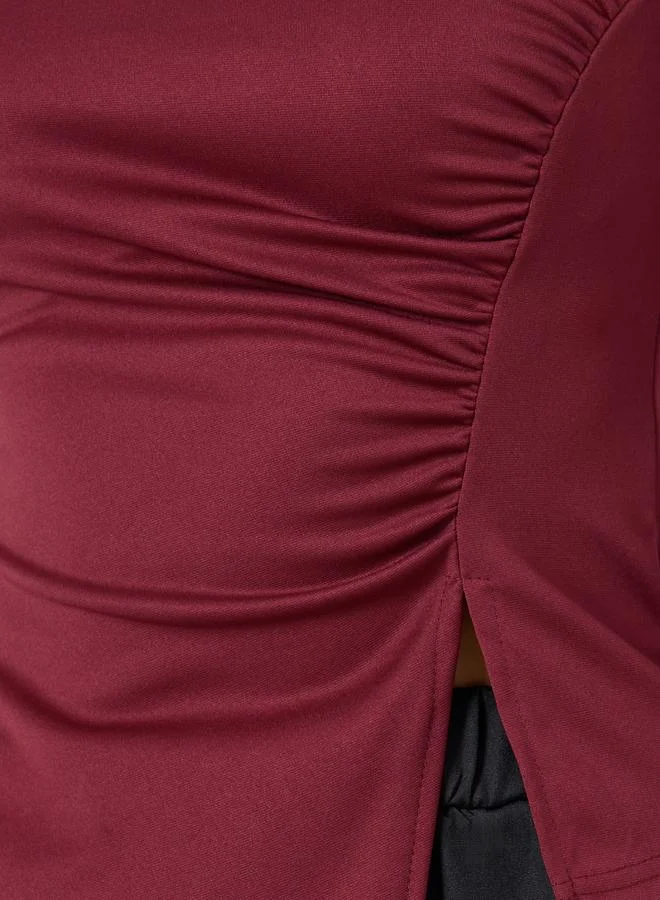 تايك تو بلوزة بأكمام طويلة وياقة غير منتظمة وحافة مشقوقة