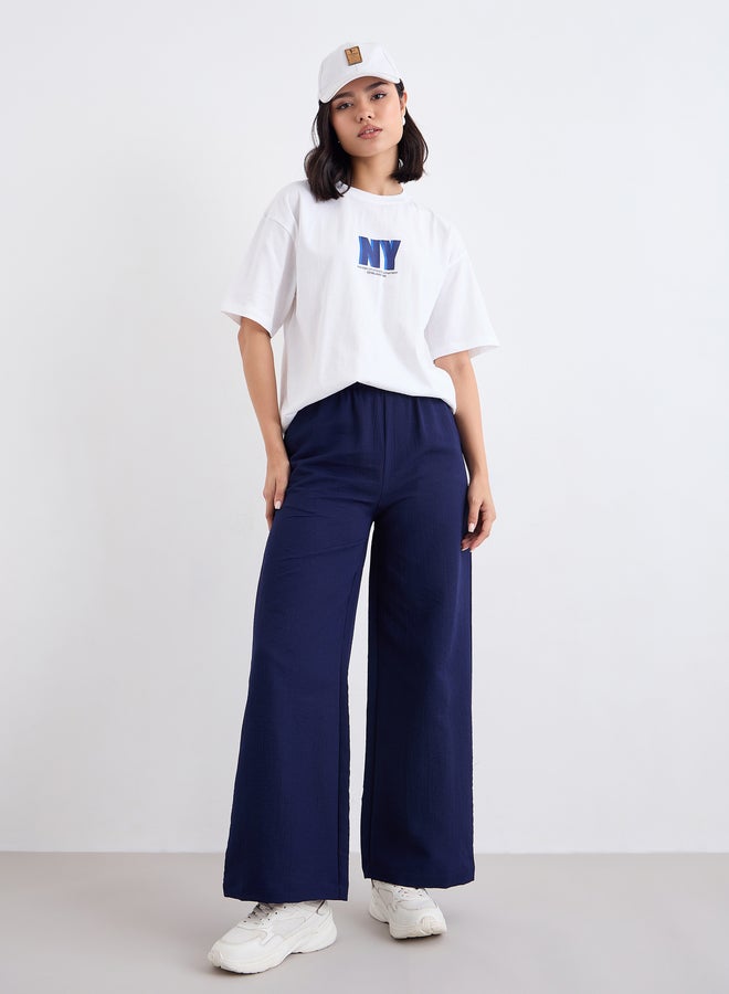 ستايلي تيشيرت طويل فضفاض بطبعة شعار ستايلي - Image 1