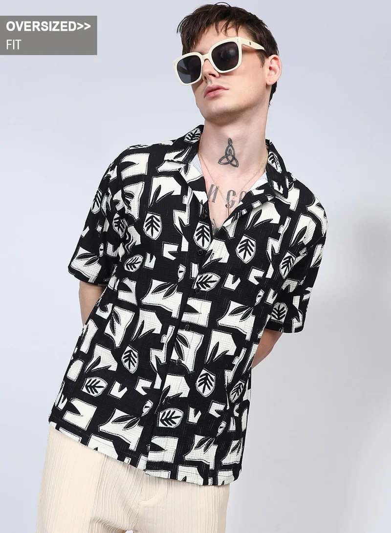 Campus Sutra Campus Sutra Men's Onyx Black Oversized Geometric Foliage Shirt For Casual Wear | Cuban Collar | Short Sleeve | Button Closure | Shirt Crafted With Comfort Fit For Everyday Wear