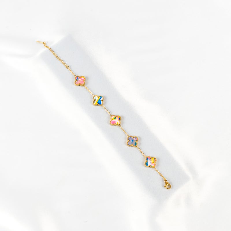 ذا بلاك بيرل اكسسوريز أنسيال أستانليس ستيل ذهبي مع شكل زهرة البرسيم بألوان خلابة - Image 1