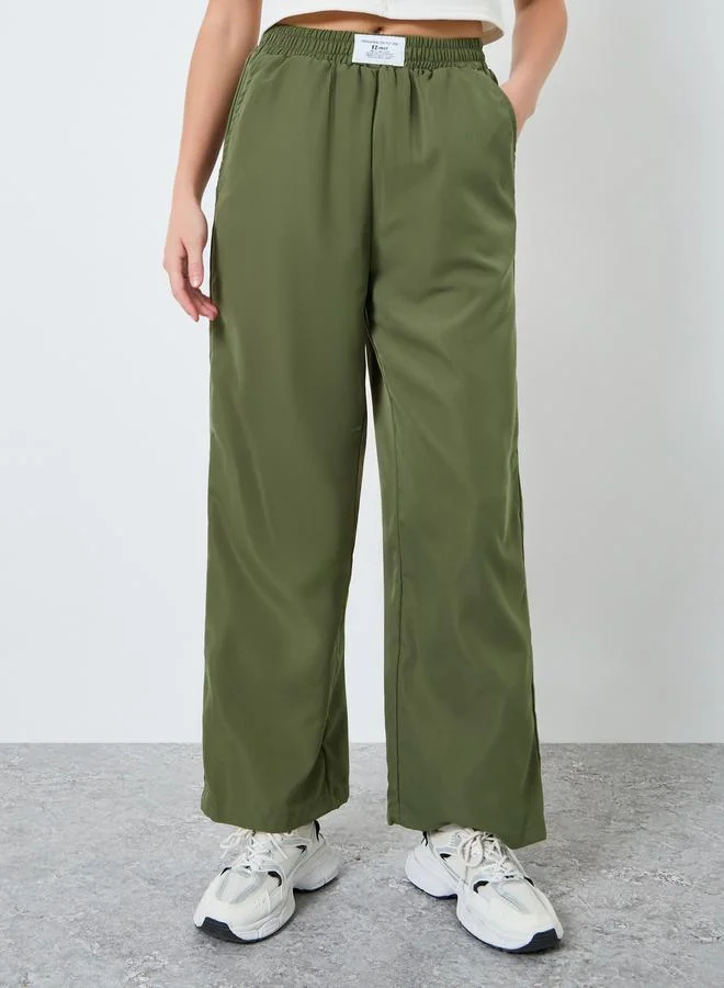 تايك تو بنطلون نسائي واسع الساقين أخضر زيتوني