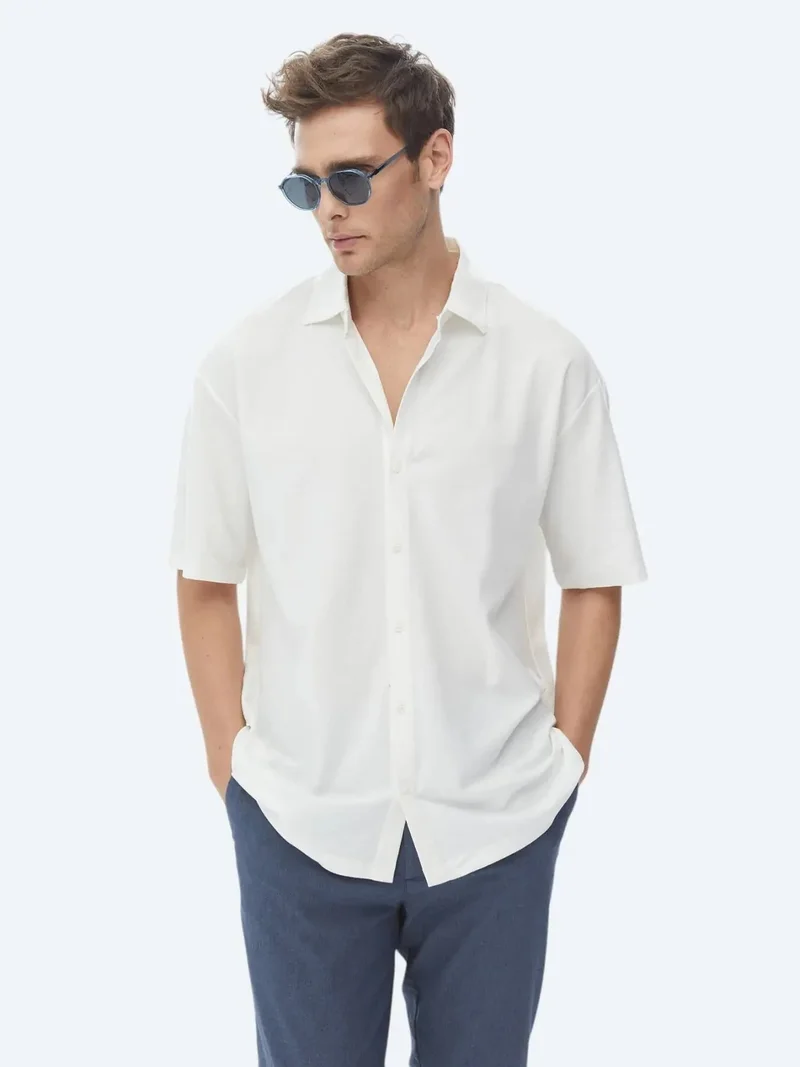 كيب قميص أبيض فضفاض محبوك من القطن الخالص 100%