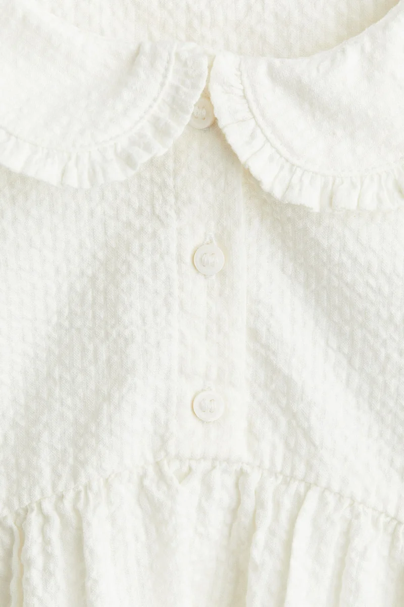 اتش اند ام بلوزة بحافة بيبلوم