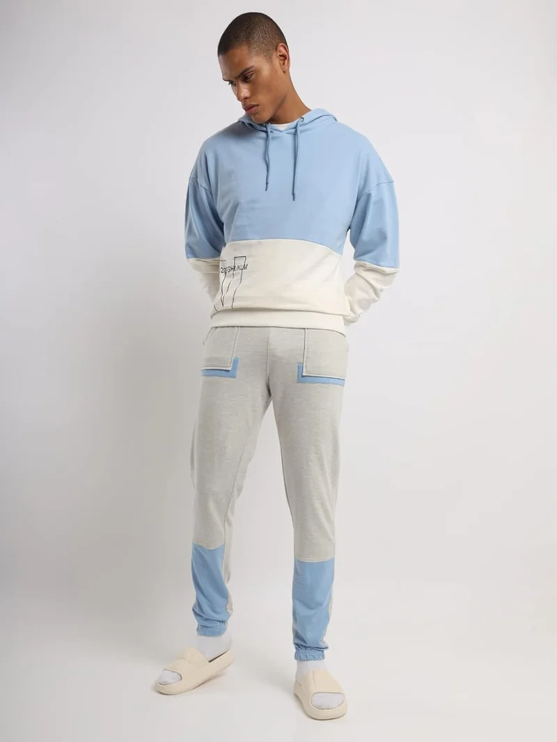 نوبيرو بنطلون رياضي رجالي من نوبرو بلون أبيض مطفي وأزرق