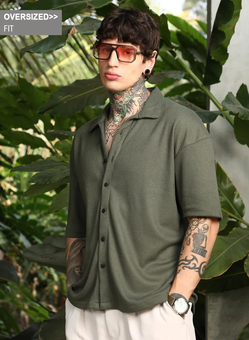 Campus Sutra Campus Sutra Men's Seaweed Green Waffle-Knit Shirt For Casual Wear | Spread Collar | Short Cuffed Sleeves | Button Closure | Oversized Shirt Crafted With Comfort Fit For Everyday Wear