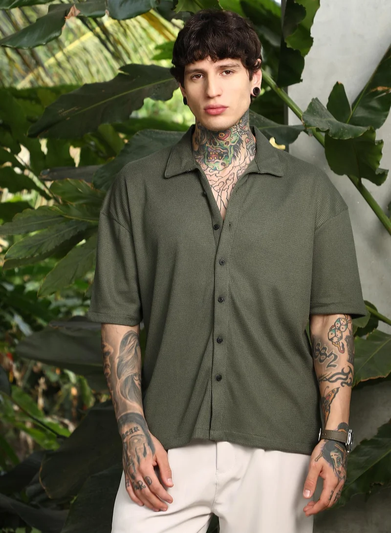 Campus Sutra Campus Sutra Men's Seaweed Green Waffle-Knit Shirt For Casual Wear | Spread Collar | Short Cuffed Sleeves | Button Closure | Oversized Shirt Crafted With Comfort Fit For Everyday Wear