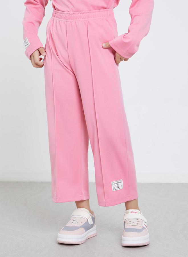 ستايلي طقم بناتي وردي بطبعة لوس أنجلوس و بنطال رياضي - Image 4