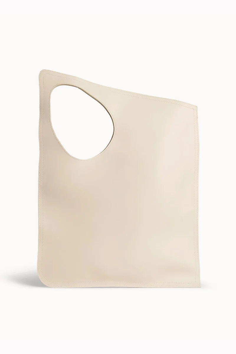 Wecre8 Beige Asymmetrical Tote Bag by WECRE8