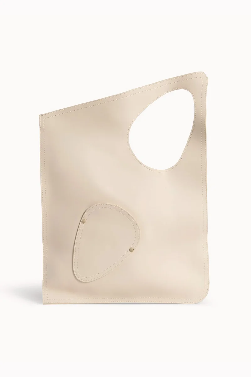 Wecre8 Beige Asymmetrical Tote Bag by WECRE8
