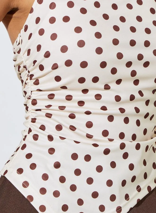 Styli  Cream Polka Dot Strapless Blouse with Asymmetric Hem for Women | Best Price UAE