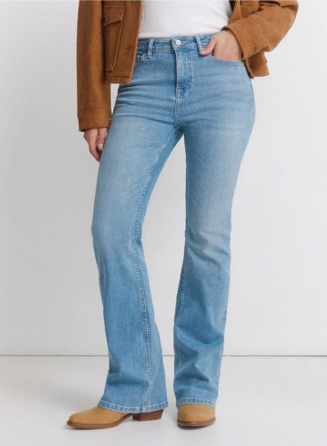Springfield  High-waisted jeans with front and back pockets, button and zip fastening fastening , and a slim fit with a flared hem . These jeans feature a state-of-the-art washing process that reduces water, chemical, and energy consumption. for Women | Best Price UAE