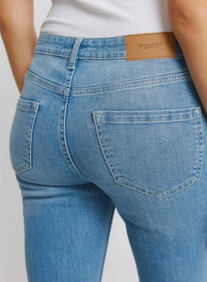 Springfield  High-waisted jeans with front and back pockets, button and zip fastening fastening , and a slim fit with a flared hem . These jeans feature a state-of-the-art washing process that reduces water, chemical, and energy consumption. for Women | Best Price UAE