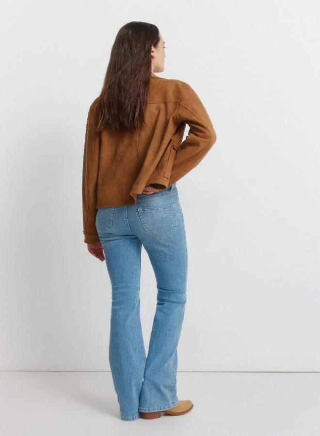 Springfield  High-waisted jeans with front and back pockets, button and zip fastening fastening , and a slim fit with a flared hem . These jeans feature a state-of-the-art washing process that reduces water, chemical, and energy consumption. for Women | Best Price UAE