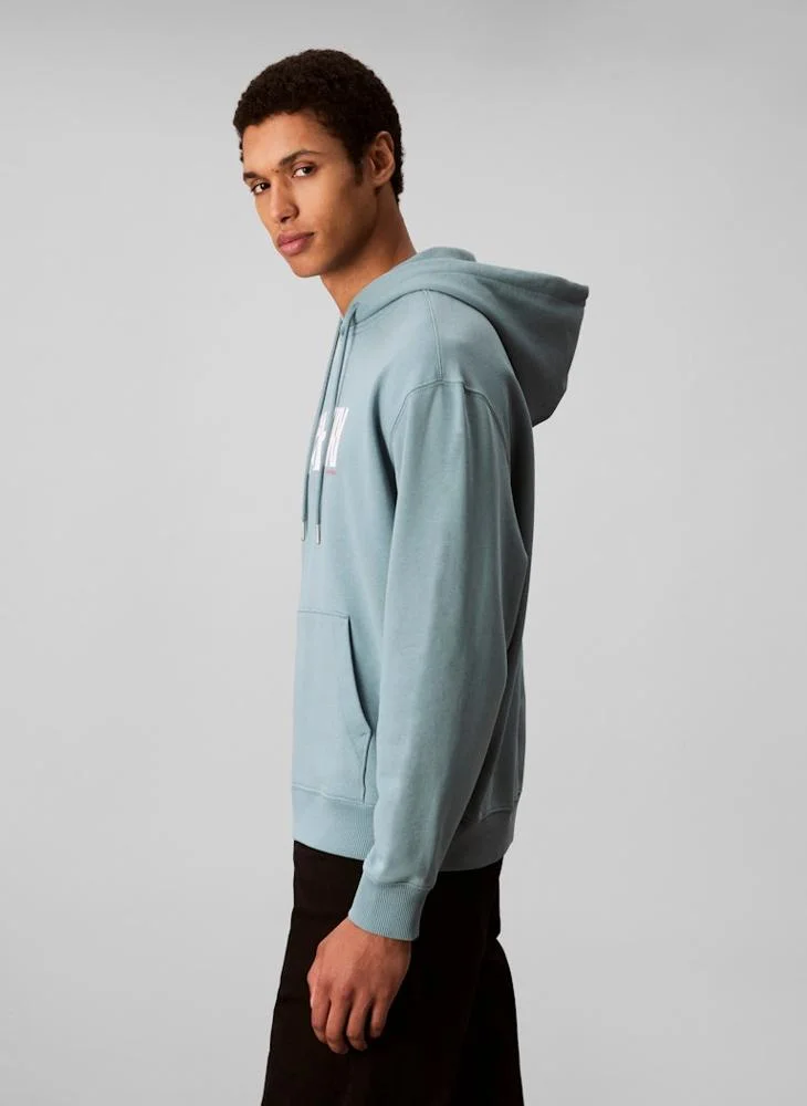 Calvin Klein Jeans  Logo Graphic Hoodie for Men | Best Price UAE