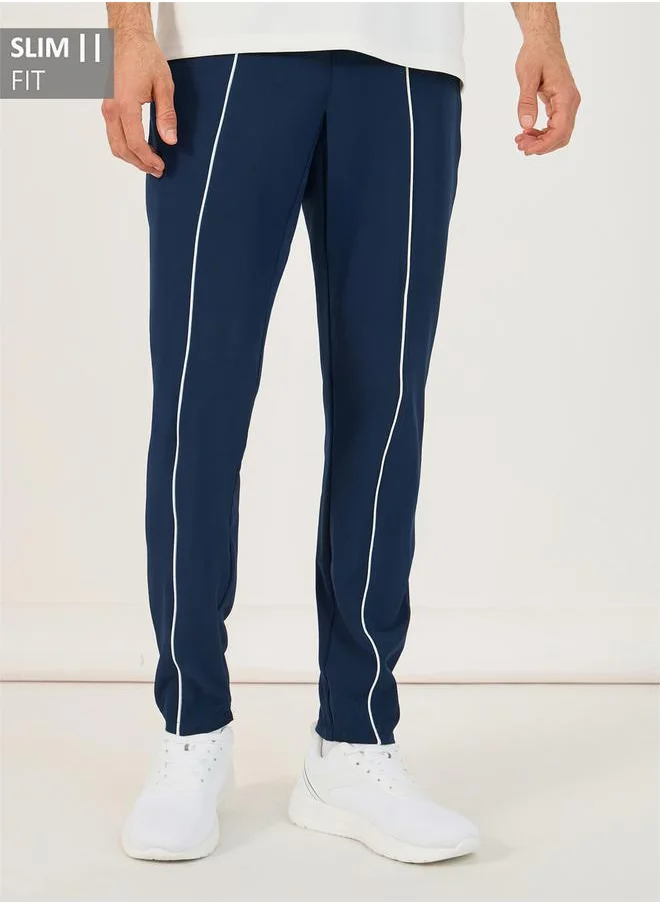 ستايلي 4-Way Stretch Compression Knit Slim Track Pants with Piping Detail