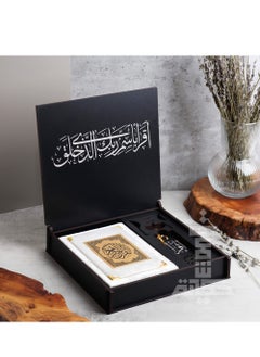A Box of The Holy Qur’an With An Incense Burner And a Qur’an Holder With The Qur’an And A Reading Break