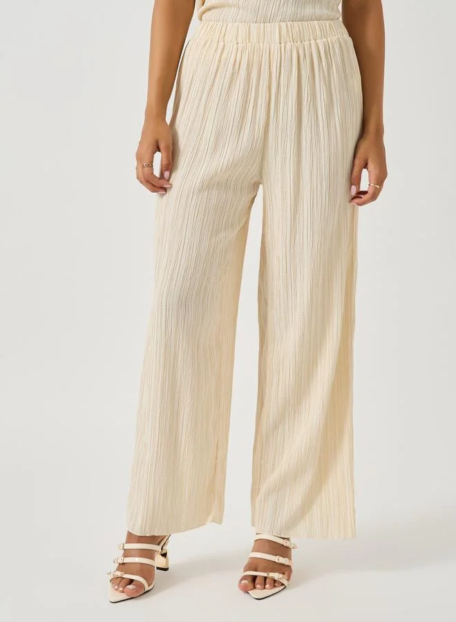 Take Two Textured Halter Neck Asymmetric Hem Top and Wide Leg Pants Co-Ords