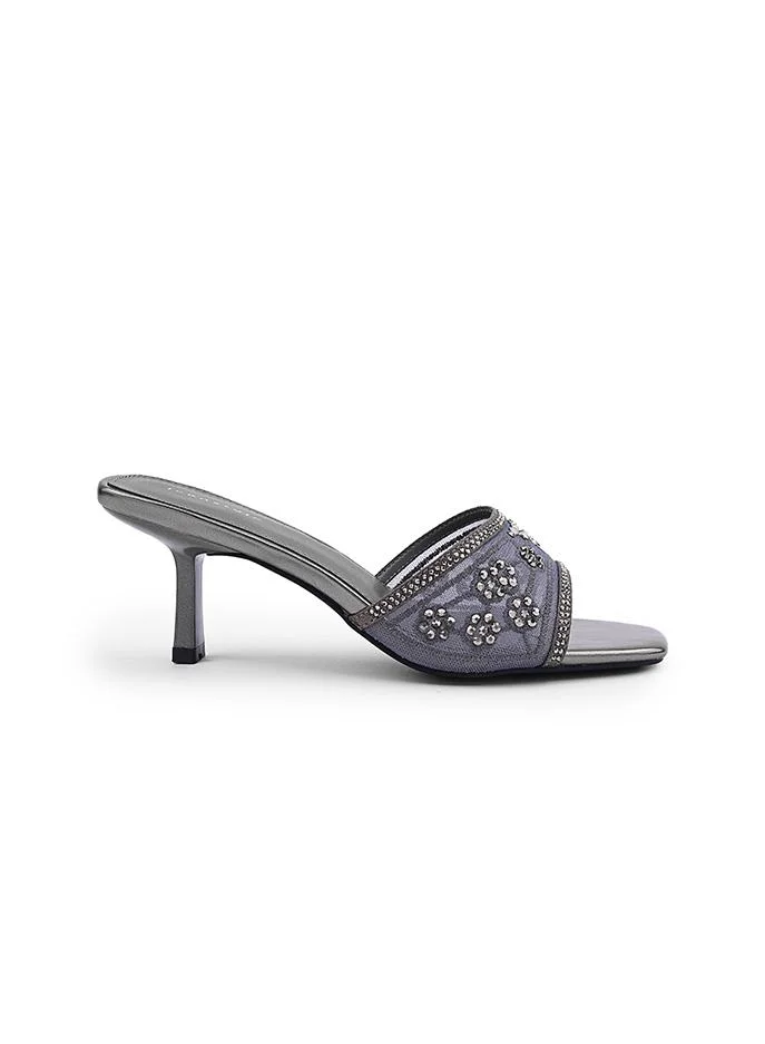 أيقون Shiny heel slipper with decorative bow accent.