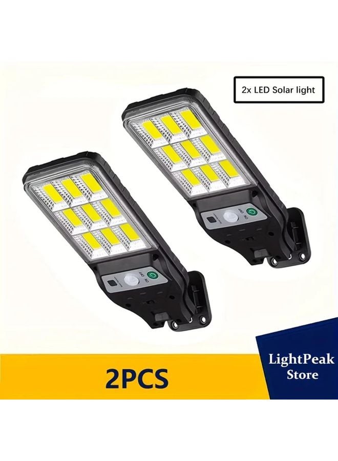 قطعتان من أضواء الحائط الشمسية ذات حساسية الحركة للإضاءة الخارجية LED للأمان - Image 1