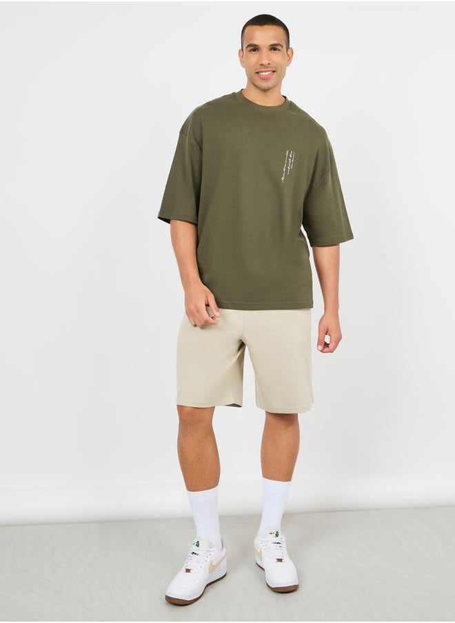 Styli Minimal Slogan Print Mock Neck Interlock Boxy Fit T-shirt  - Image 2