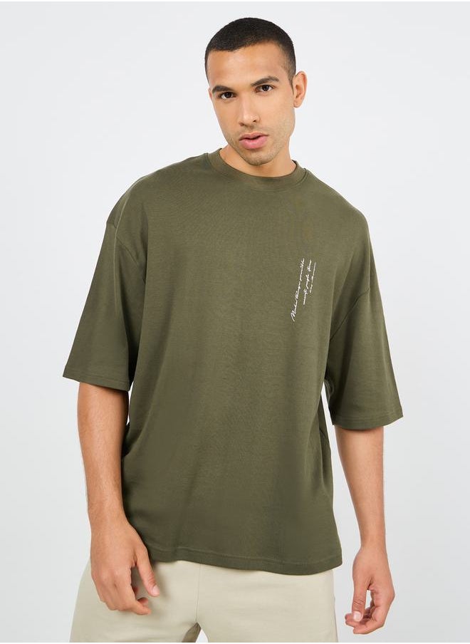 Styli Minimal Slogan Print Mock Neck Interlock Boxy Fit T-shirt  - Image 1