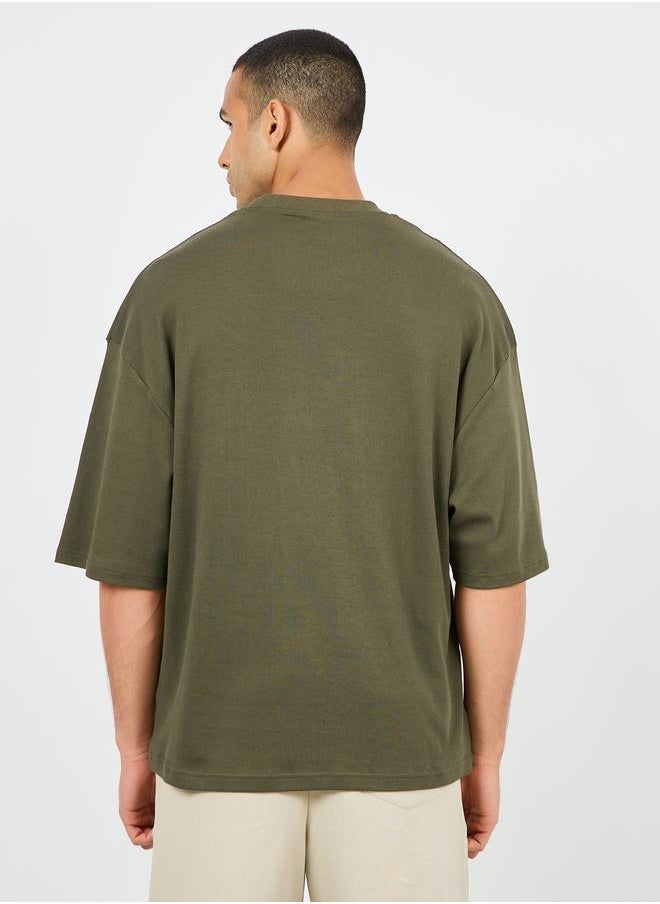 Styli Minimal Slogan Print Mock Neck Interlock Boxy Fit T-shirt  - Image 4