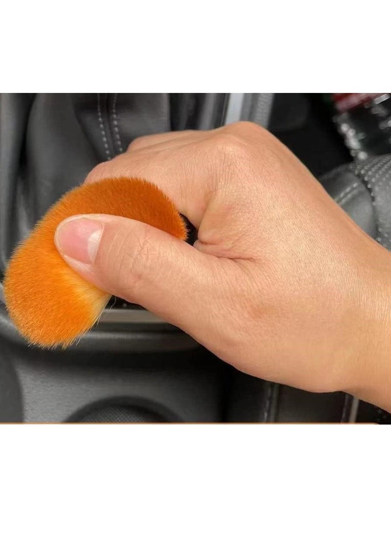 The cleaning brush's small, precise design helps you reach the smallest corners between buttons and remove dust easily. - Image 3