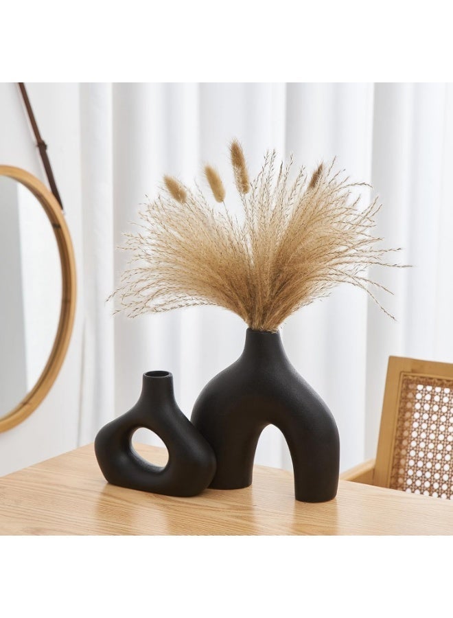 Razz Gallery This elegant black vase set consists of two matching pieces with a design that combines simplicity and elegance. - Image 2