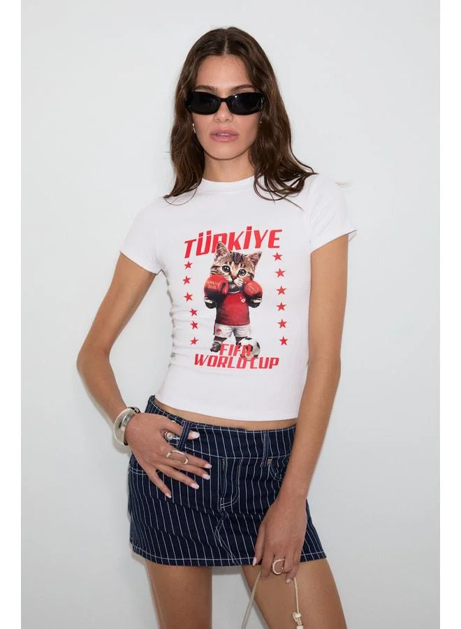 GRIMELANGE YULA Women's Soft and Stretchy Fabric Organic Cotton World Cup Special Print White T-Shirt.