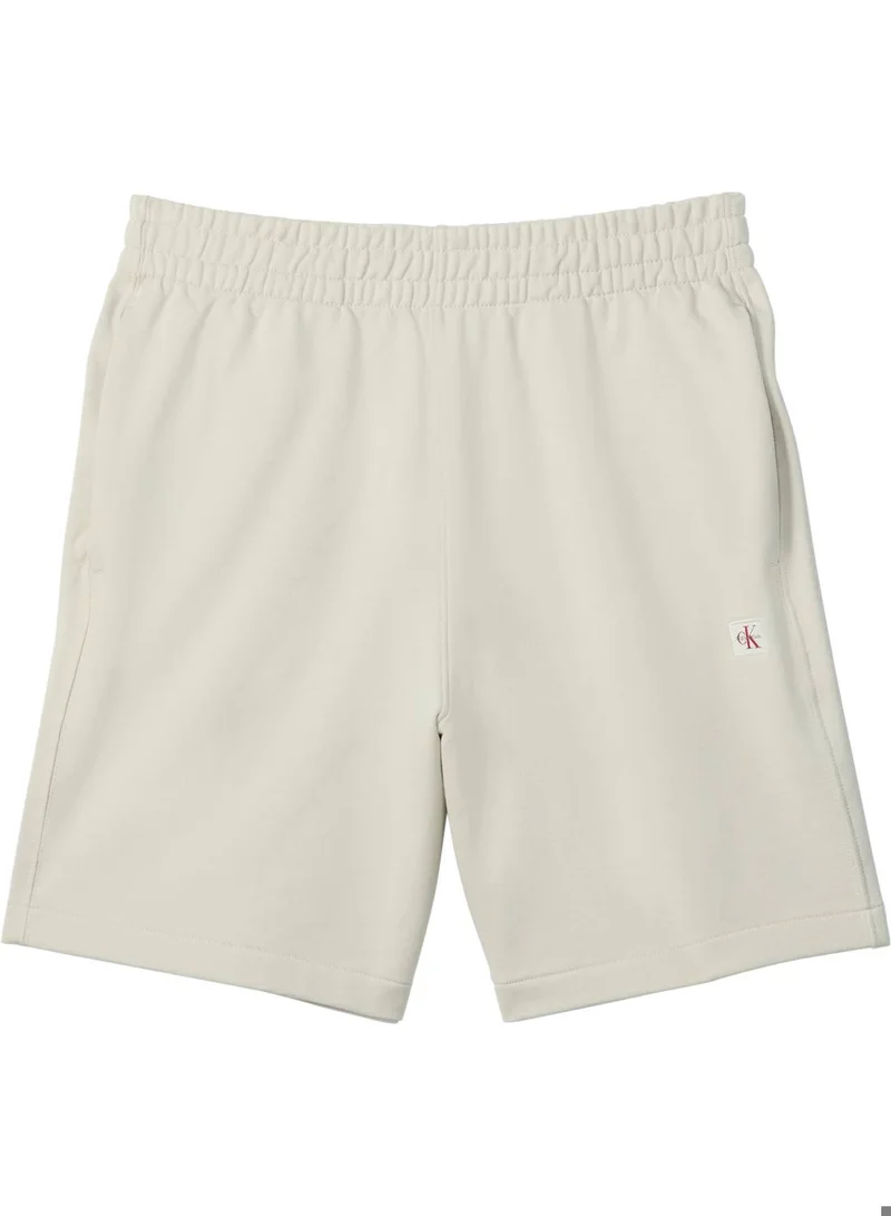 Calvin Klein Jeans Oatmeal Cotton Terry Badge Jogger Shorts for Men | Best Price UAE