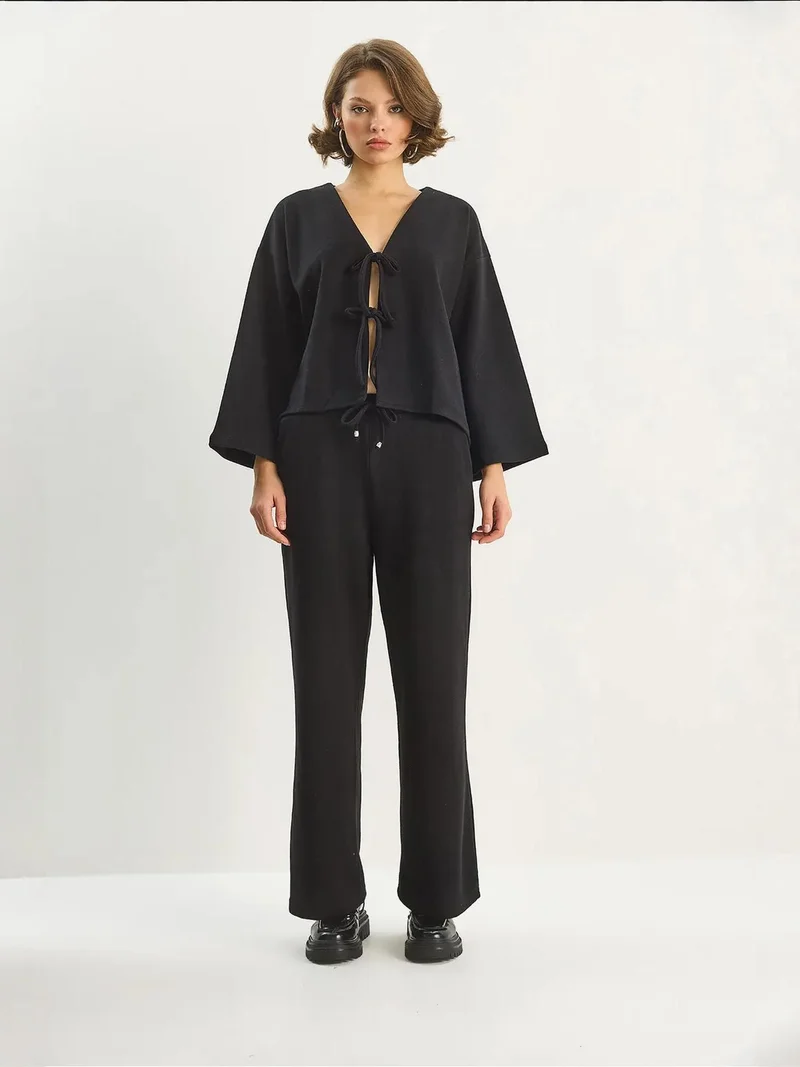 بيانكو لوتشي طقم كارديجان محبوك بياقة على شكل حرف  وبنطلون واسع الساق