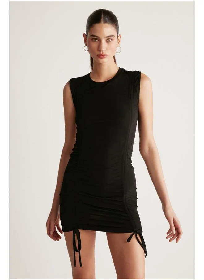 GRIMELANGE Grimelange Rachel Women's Draped Skirt Adjustable Length Bodycon Sandy Stretch Fabric Mini Black Dress