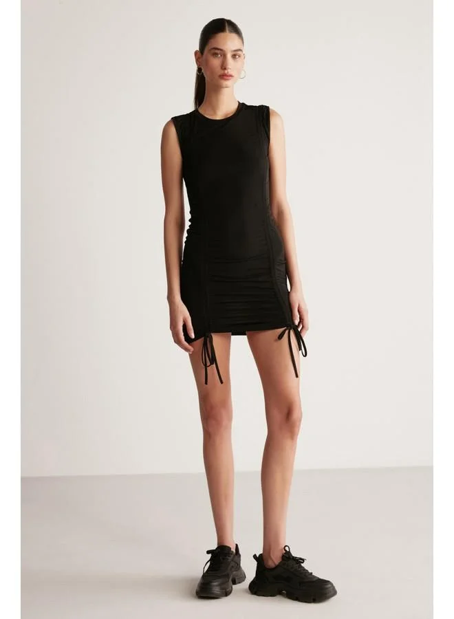 GRIMELANGE Grimelange Rachel Women's Draped Skirt Adjustable Length Bodycon Sandy Stretch Fabric Mini Black Dress
