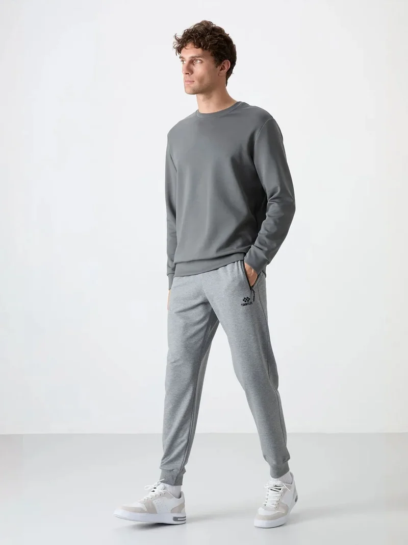 تومي لايف TOMMY Men's Solid Pull-on Sweatpants With Zip Pocket