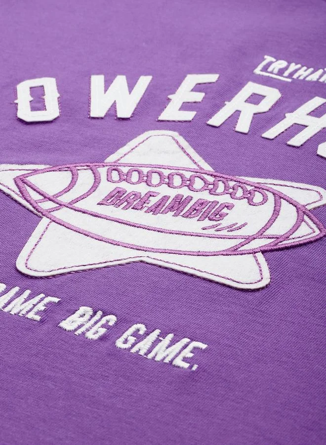 ديلينجر تيشيرت واسع بتفاصيل مرقعة وأكمام قصيرة