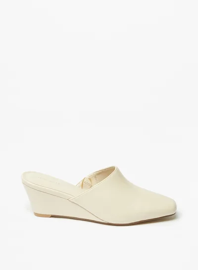 فلورا بيلا من شو إكسبرس Womens Solid Slip-On Mules with Wedge Heels